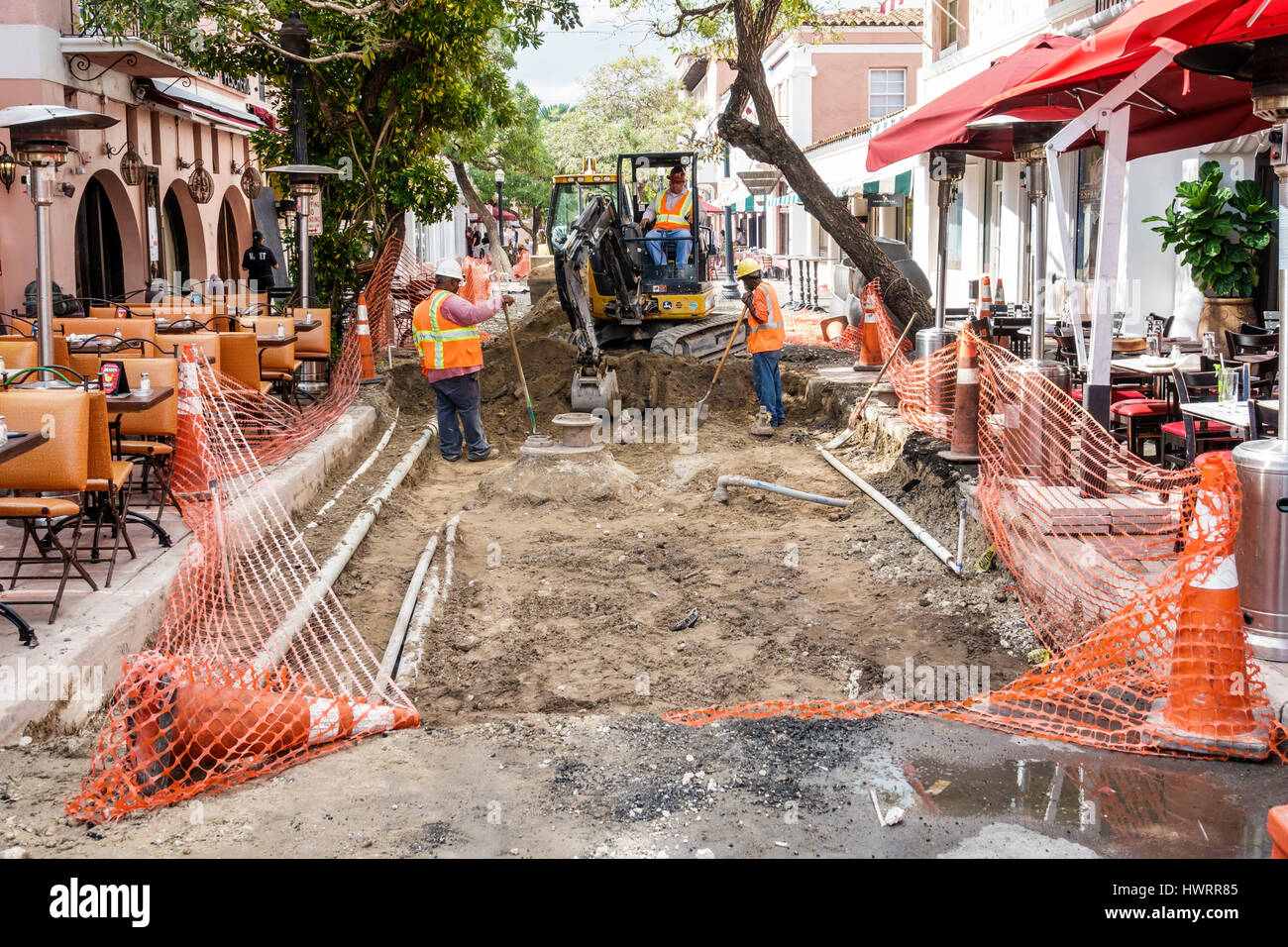 Miami Beach Florida,Espanola Way,historic Preservation District,public works,street construction,pavement,excavation,dirt,safety barrier,Black man men Stock Photo