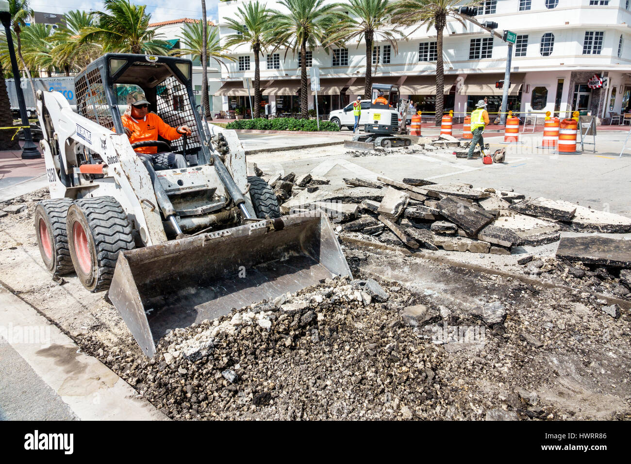 Miami Beach Florida,Ocean Drive,public works,street construction,pavement,excavation,man men male,heavy equipment,operator,working,job,torn-up road,Bo Stock Photo