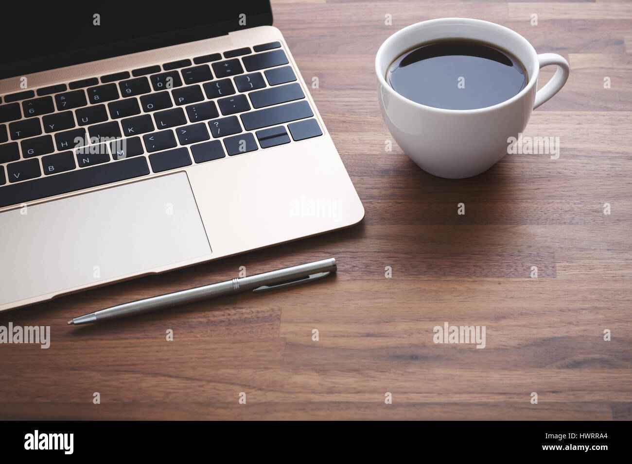 Office desk with laptop and coffee cup Stock Photo - Alamy