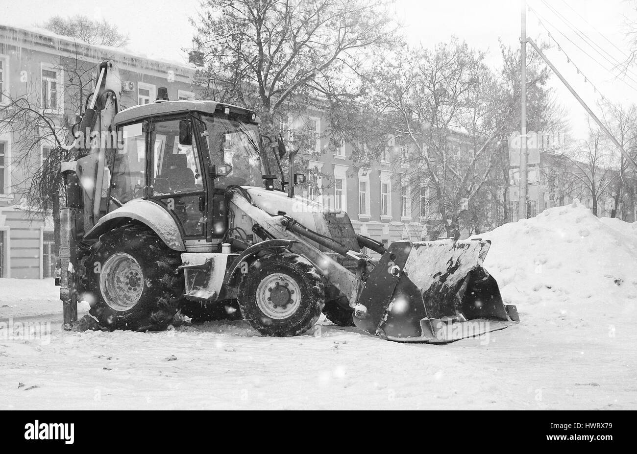 snow machine with a bucket outdoor street city Stock Photo Alamy