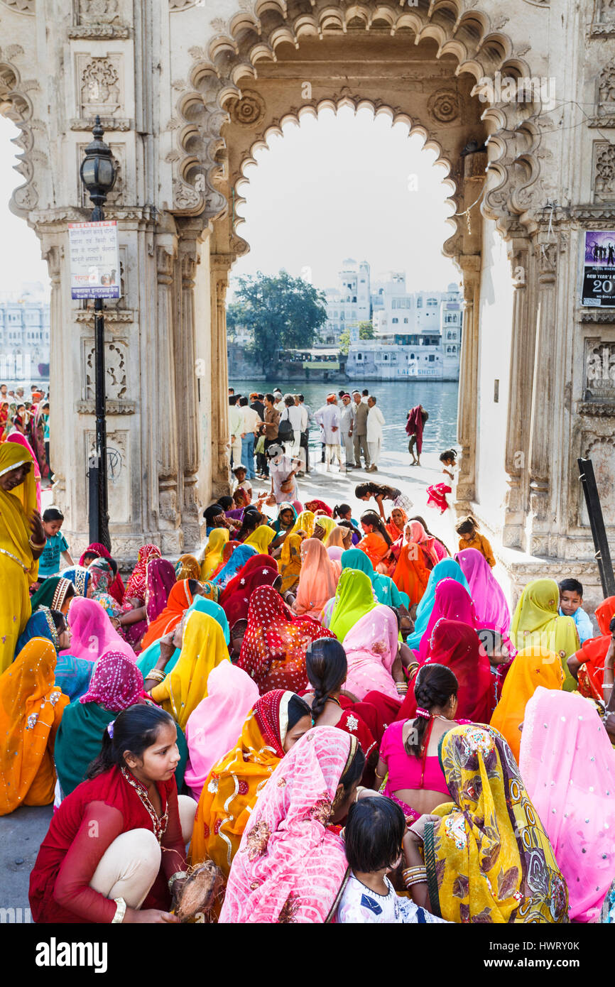 Group of local Indian women, wedding guests in colourful local dress, traditional saris, Pichola Lake, Udaipur, Indian state of Rajasthan Stock Photo
