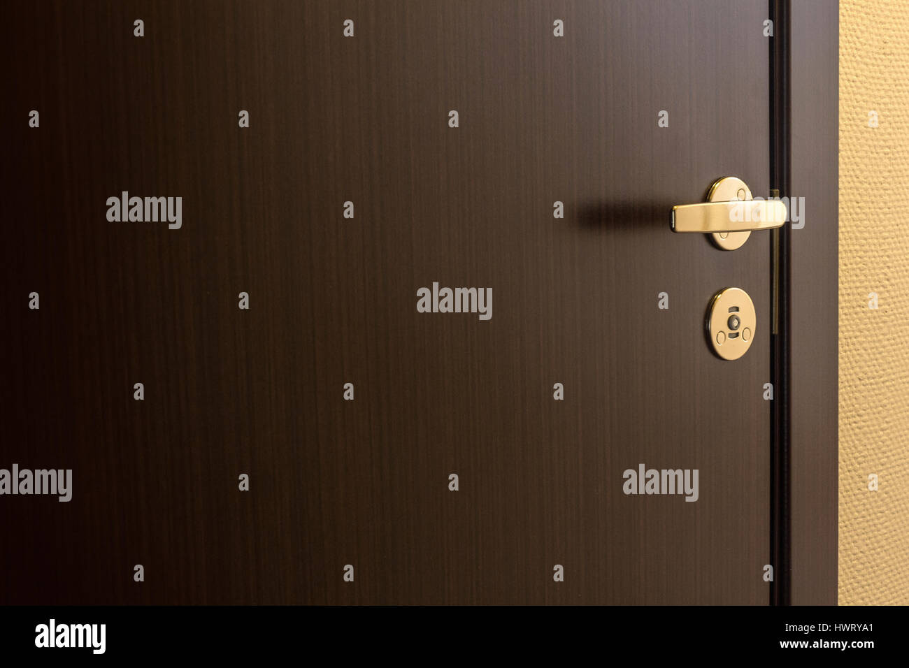 Closed brown door of hotel room background Stock Photo - Alamy