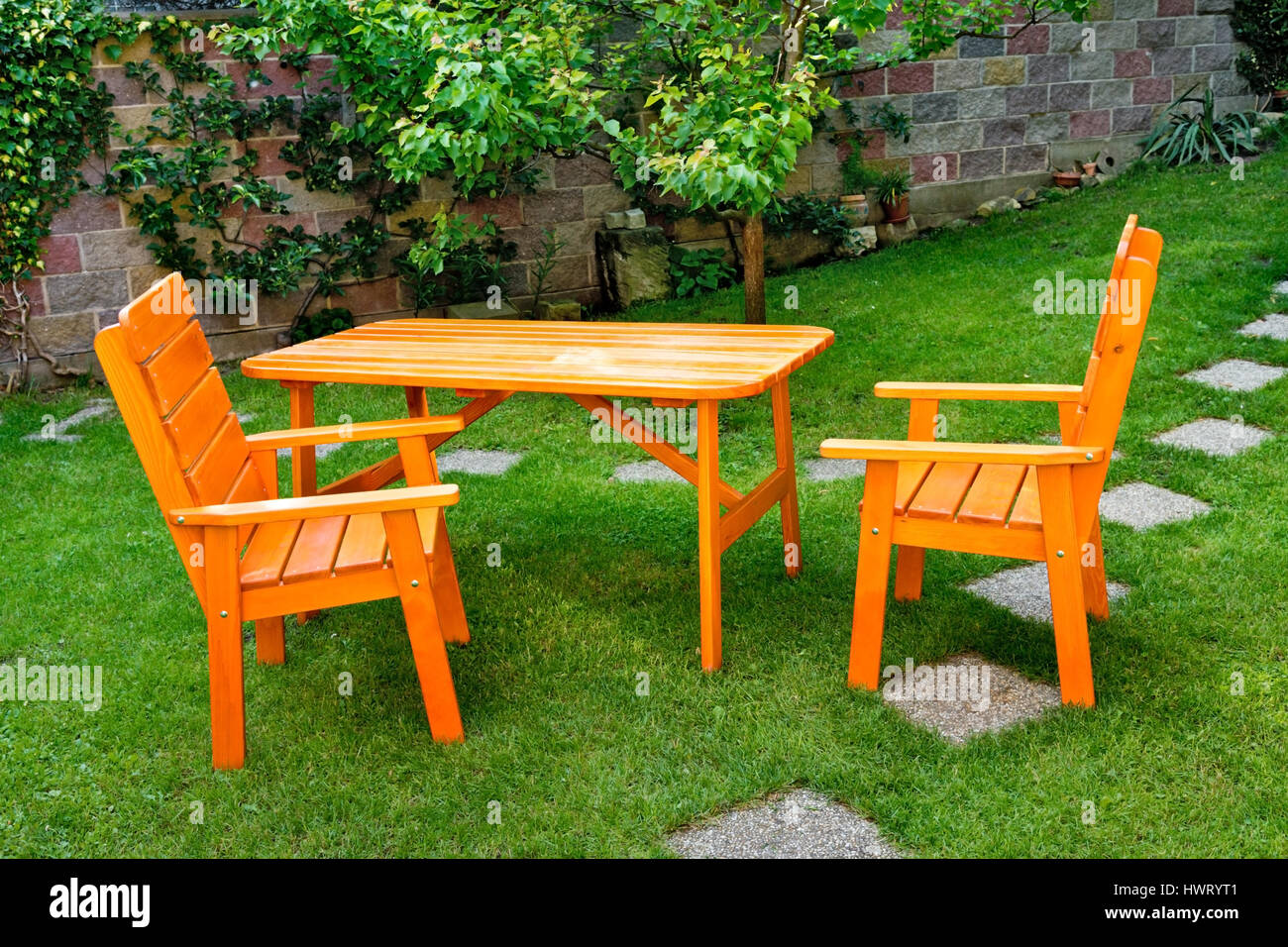 a deska and two chairs in the garden Stock Photo