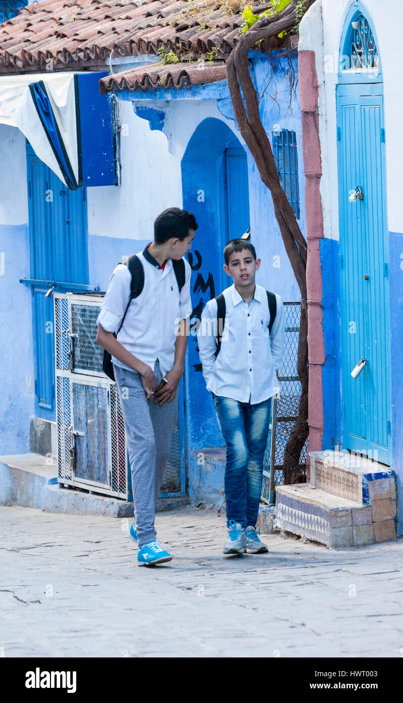 Chefchaouen, Morocco.  Two Teenage Boys Walking Home after School. Stock Photo