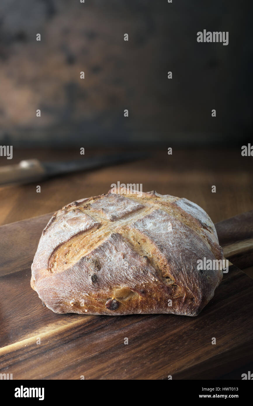Rustic bread on cutting board Stock Photo