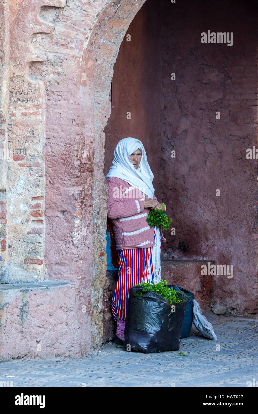 Chefchaouen, Morocco.  Woman Selling Mint at the Entrance to the medina. Stock Photo