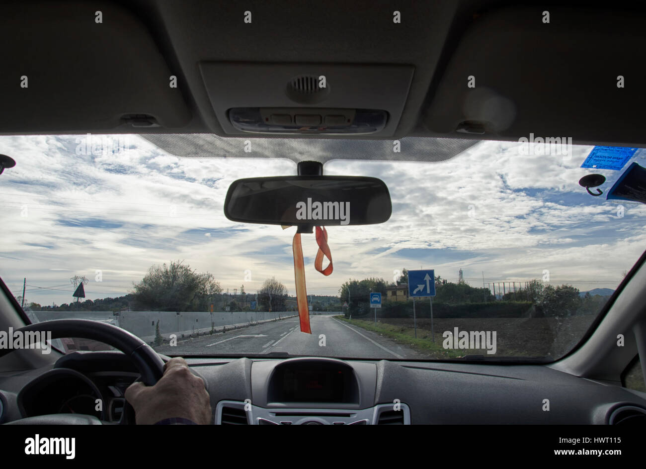 View of steering wheel and driving mirror Stock Photo Alamy