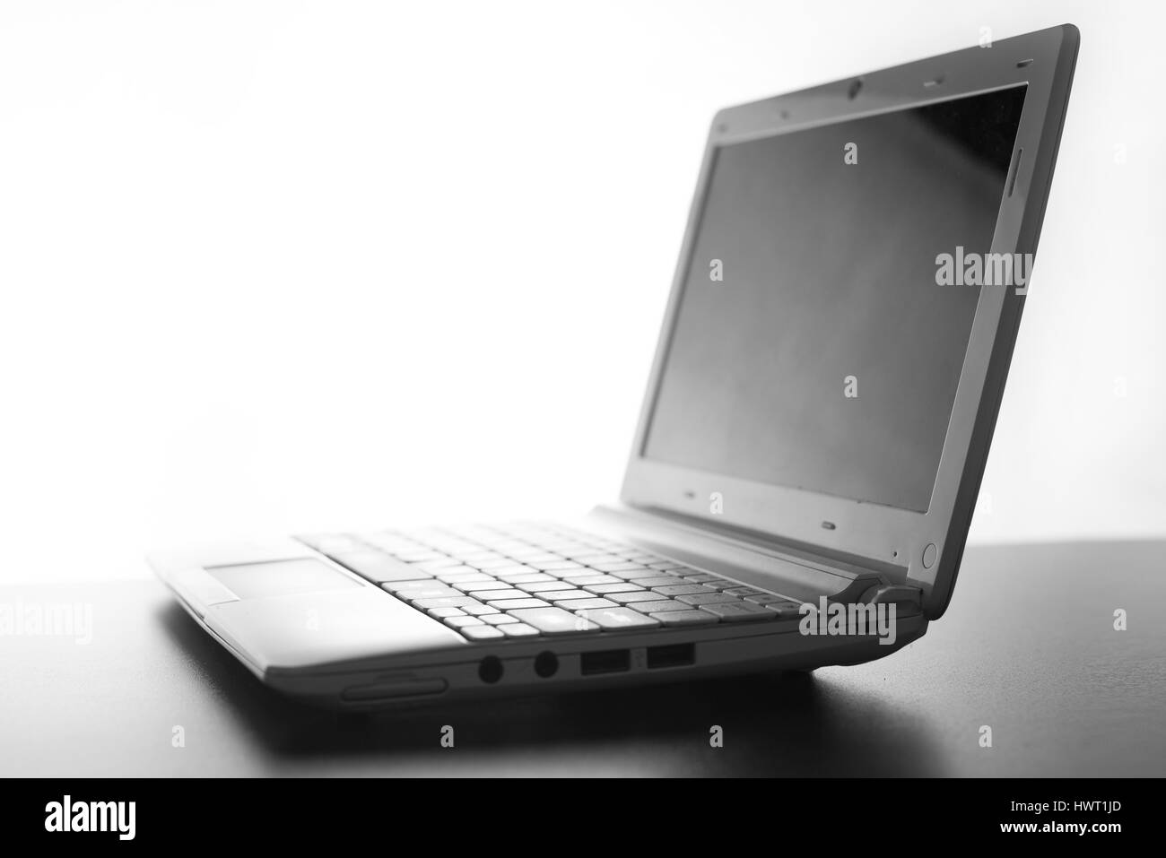 Compact white laptop silhouette on white background Stock Photo