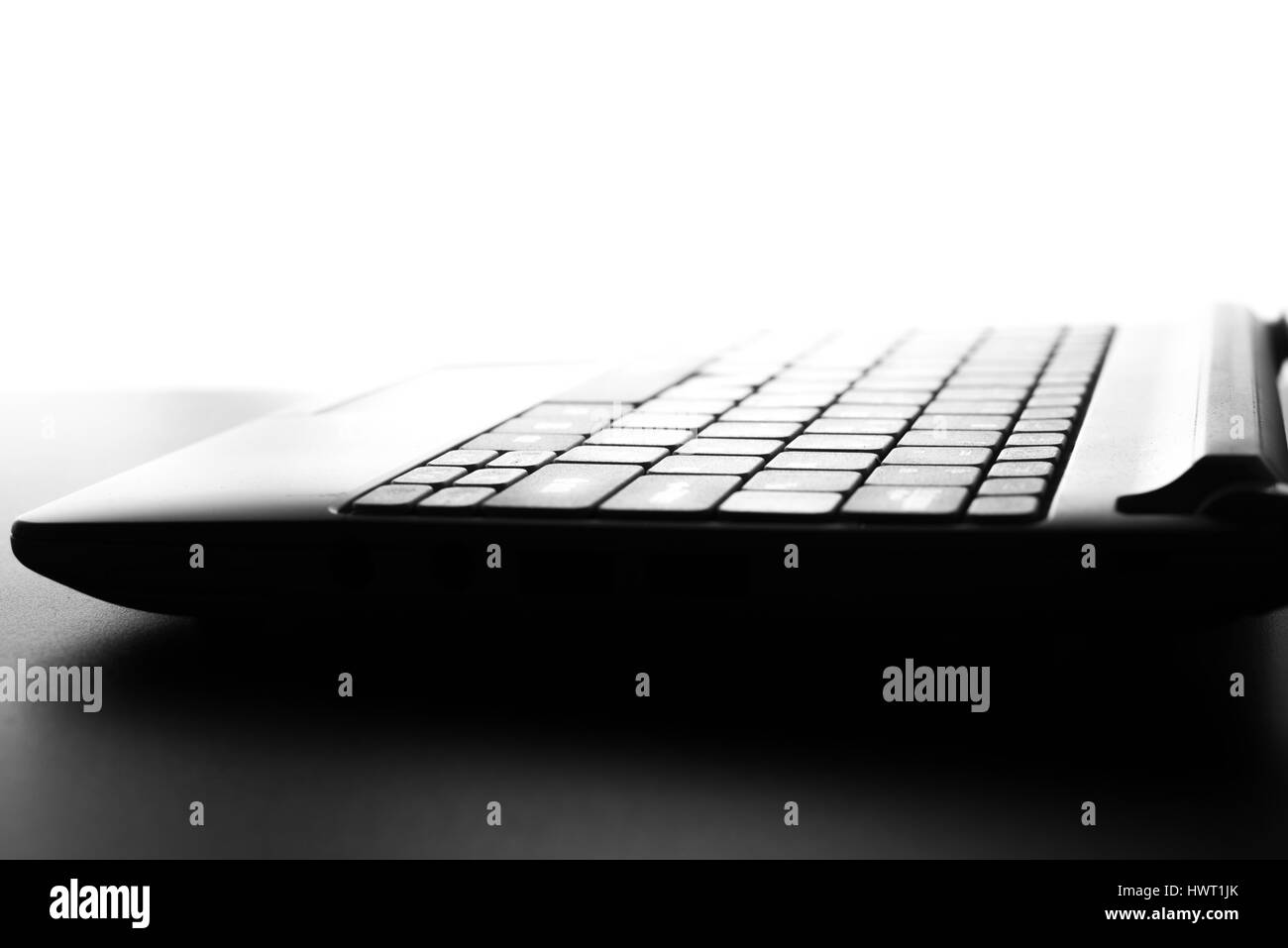 Compact white laptop silhouette on white background Stock Photo