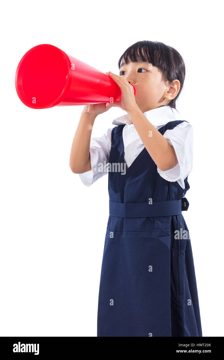 Asian Chinese little primary school girl holding retro megaphone in