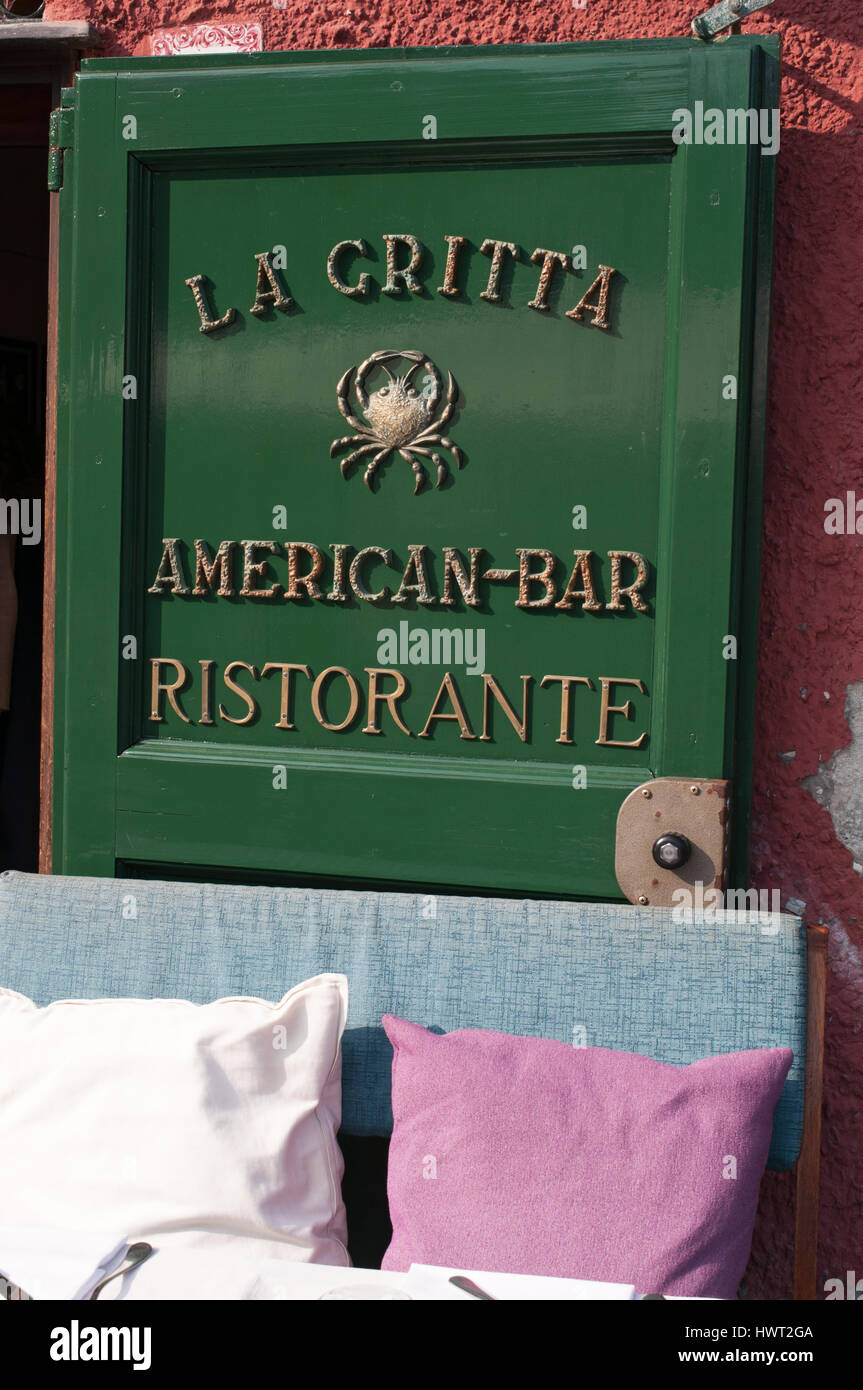 Portofino: cushions and table outside La Gritta American bar, famous restaurant since 1954 meeting place for the international jet-set and royals Stock Photo