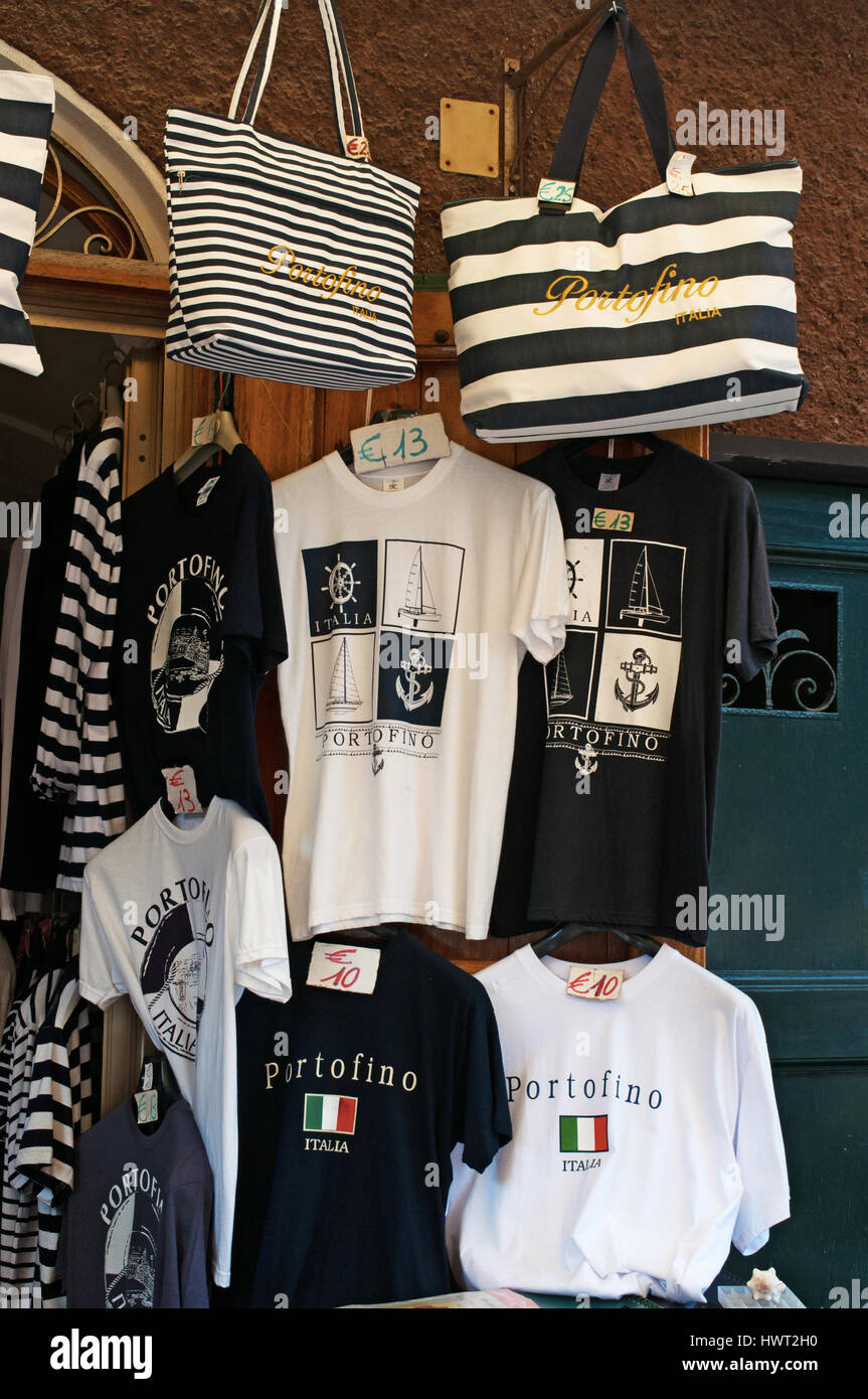 Italy: t-shirts and bags hanging outside of a gift shop in Piazzetta, the little square of Portofino, a famous Italian fishing village Stock Photo