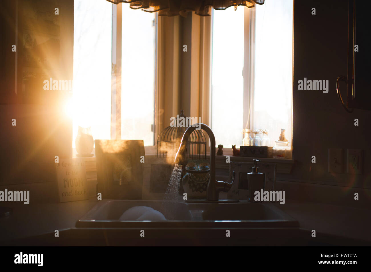 Sunlight emitting through window in kitchen at home Stock Photo - Alamy