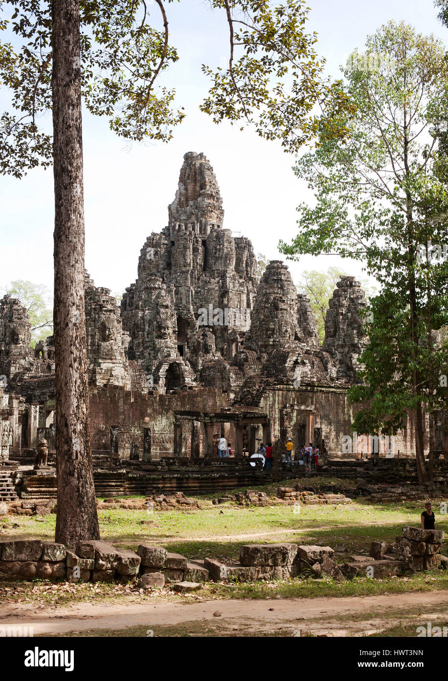 Angkor Wat temple by trees against sky Stock Photo