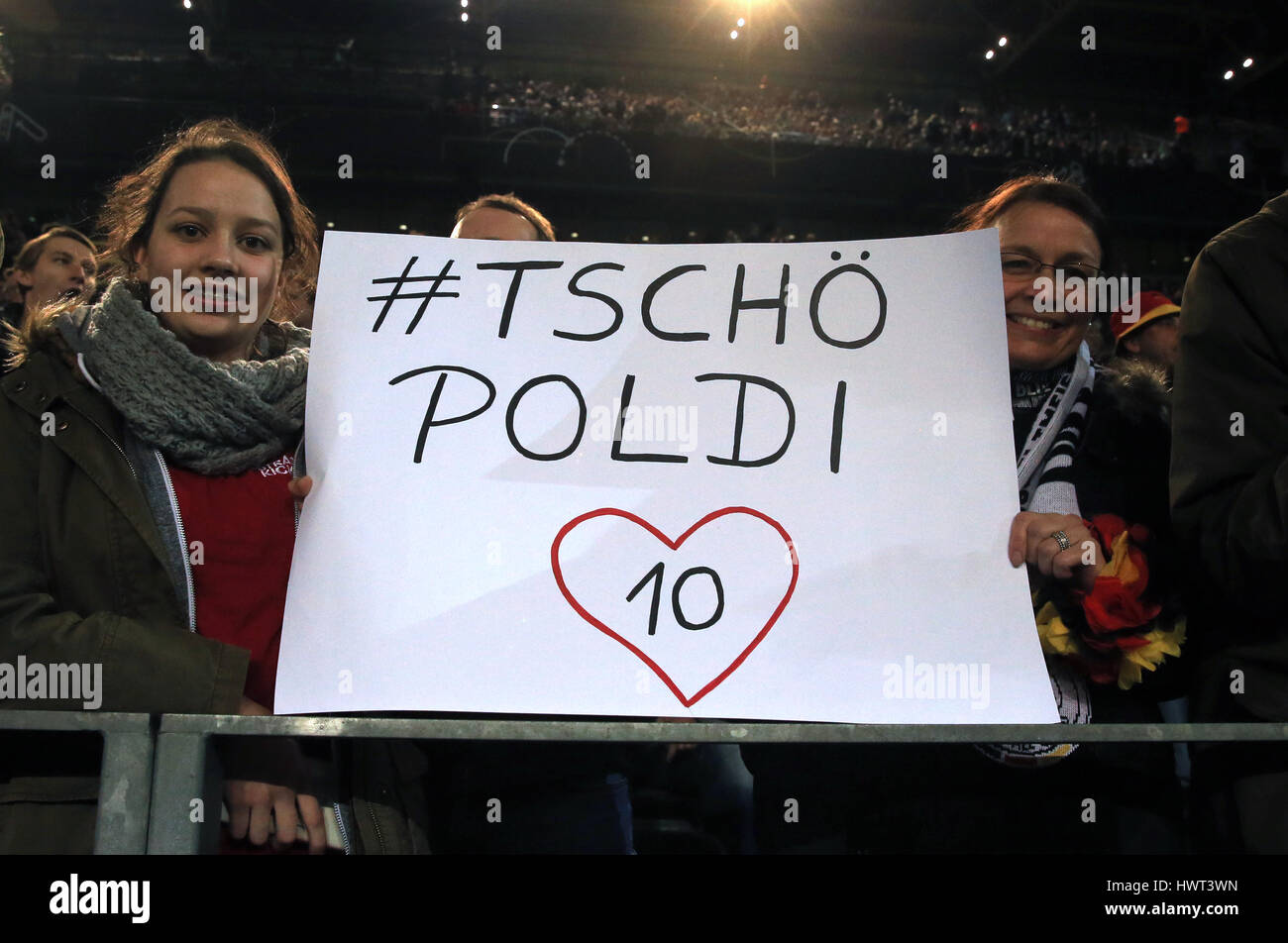 Germany fans hold banners in support of Lukas Podolski before the International Friendly match at Signal Iduna Park, Dortmund. Stock Photo