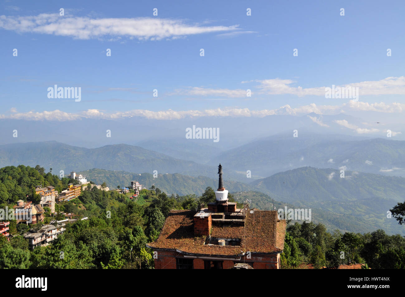 Roof top view on nepalese himalayas and hotel with stupa (mortar) on it