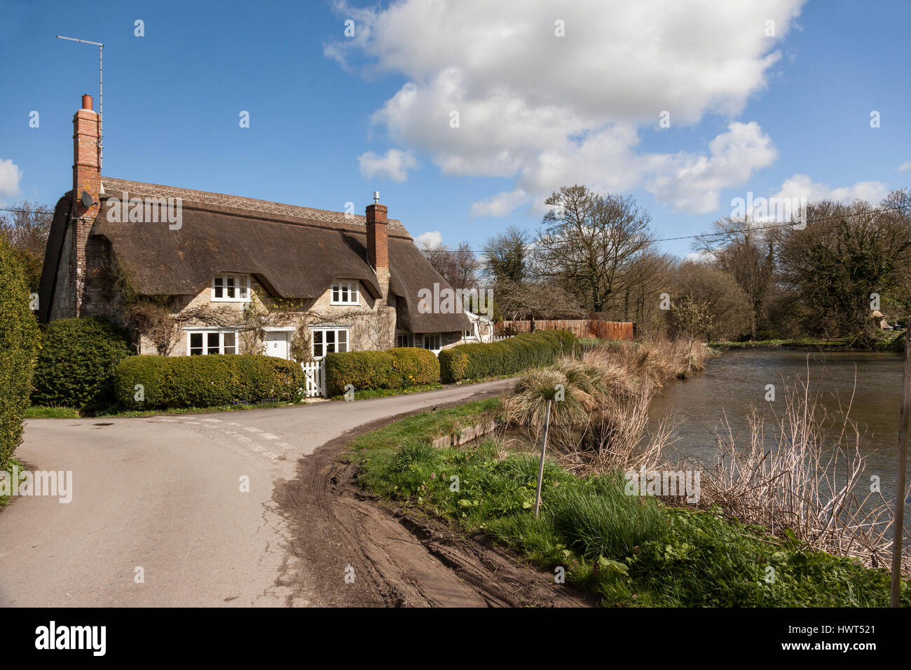 A thatched cottage in the pretty village of Sherrington, Wiltshire, England, UK Stock Photo
