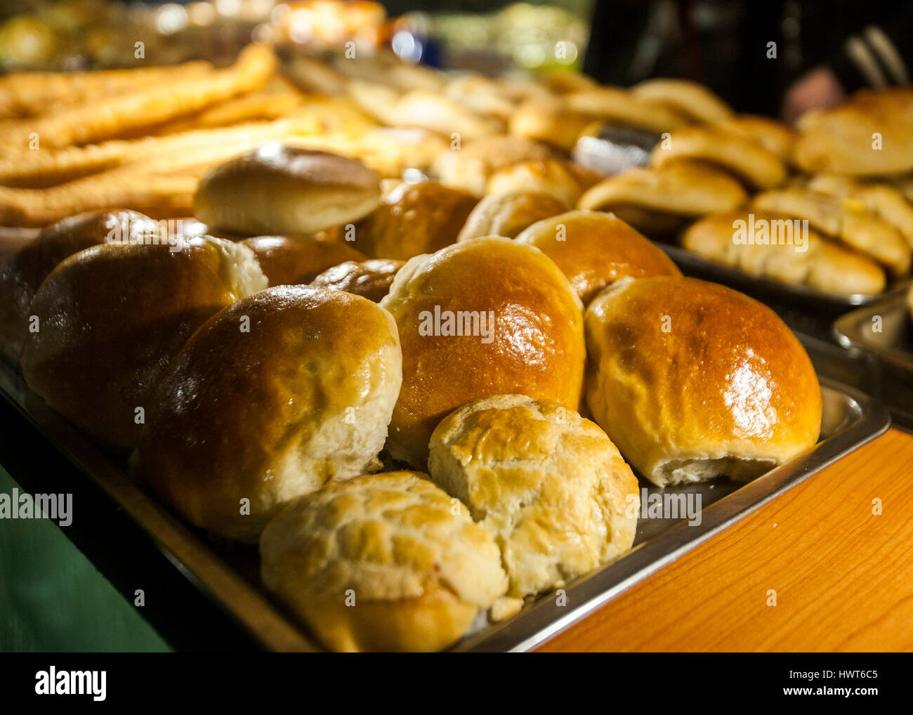 bread rolls on bakers tray in shop window Stock Photo Alamy