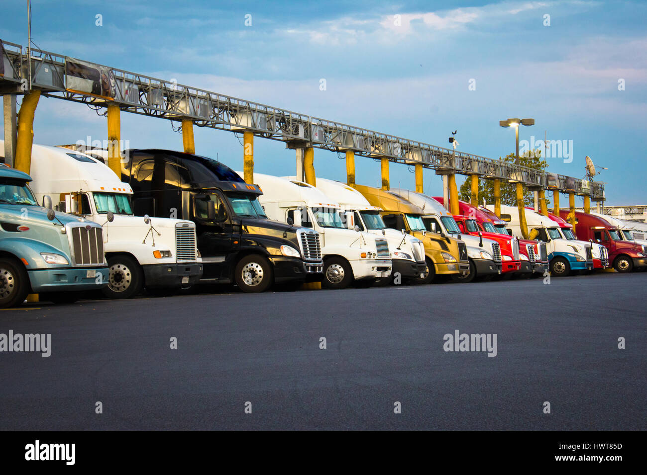 Semi Trucks at truck stop. Gas station with diesel trucks fueling up in