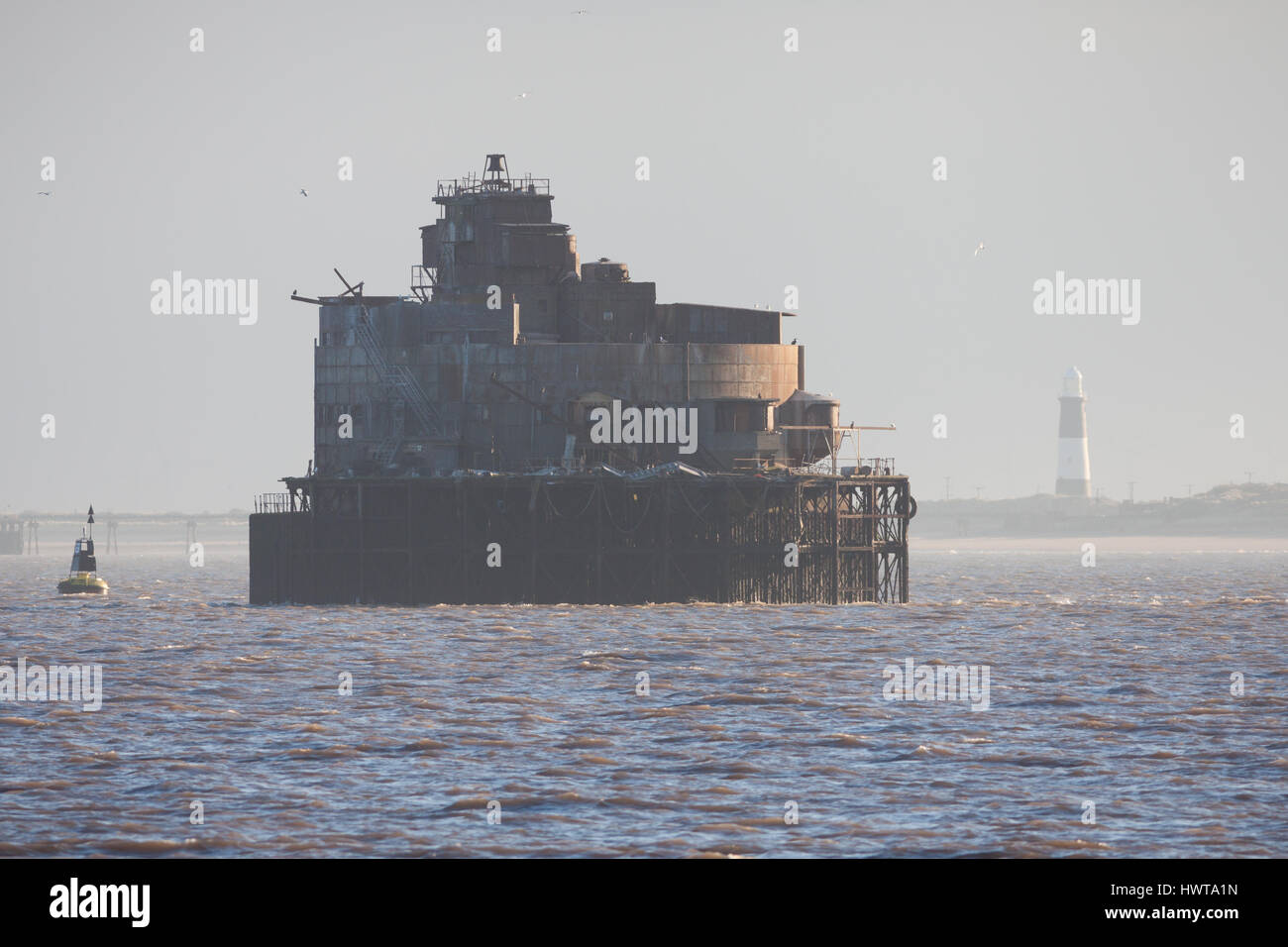 Bull Sand Fort in the Humber Estuary, with Spurn Head lighthouse in the distance Stock Photo