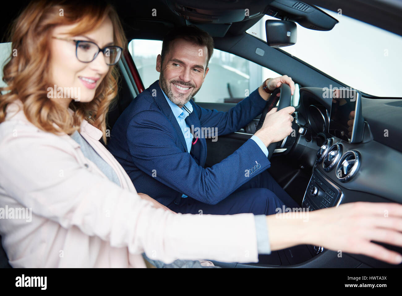 Couple sitting in the front passengers seats Stock Photo Alamy