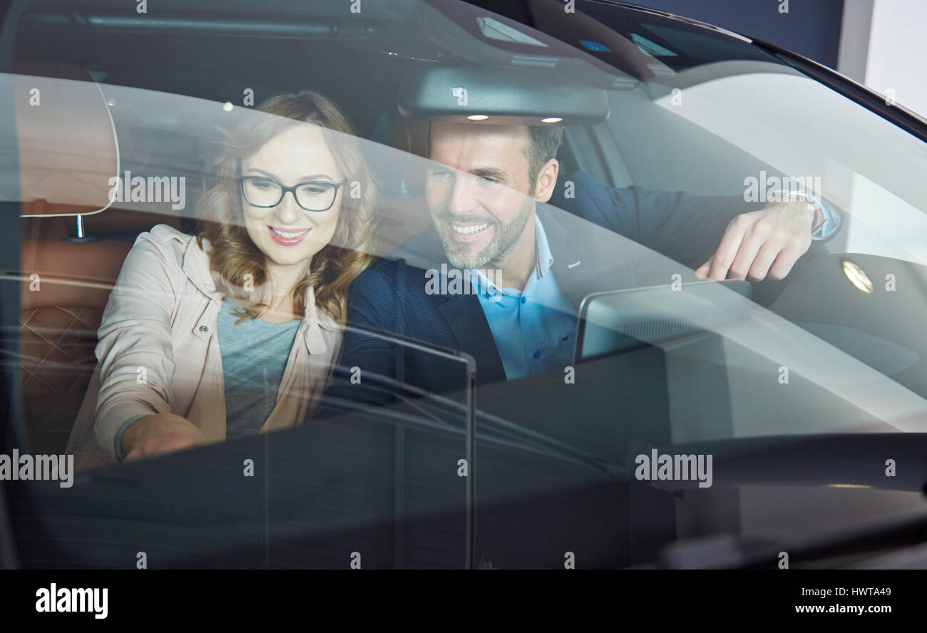Marriage buying car in the showroom Stock Photo