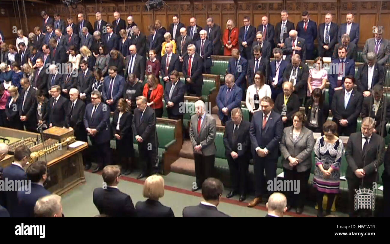 Members of the House of Parliament observe a minutes silence to pay respect to the victims of yesterday's terror attack in Westminster. Stock Photo