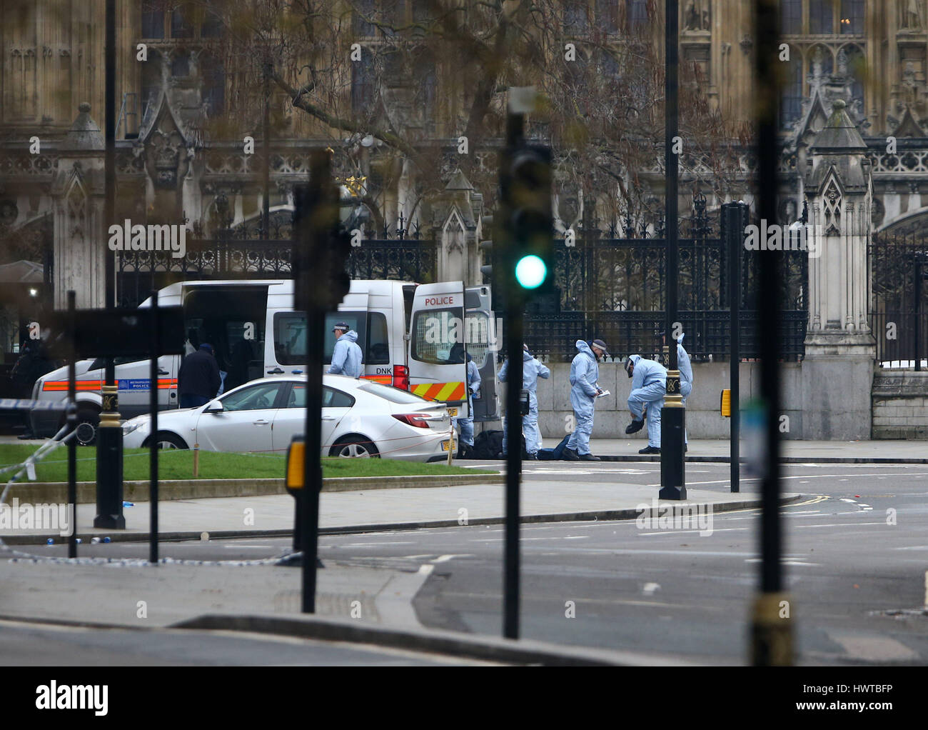 Police forensic officers outside the Houses of Parliament in London ...