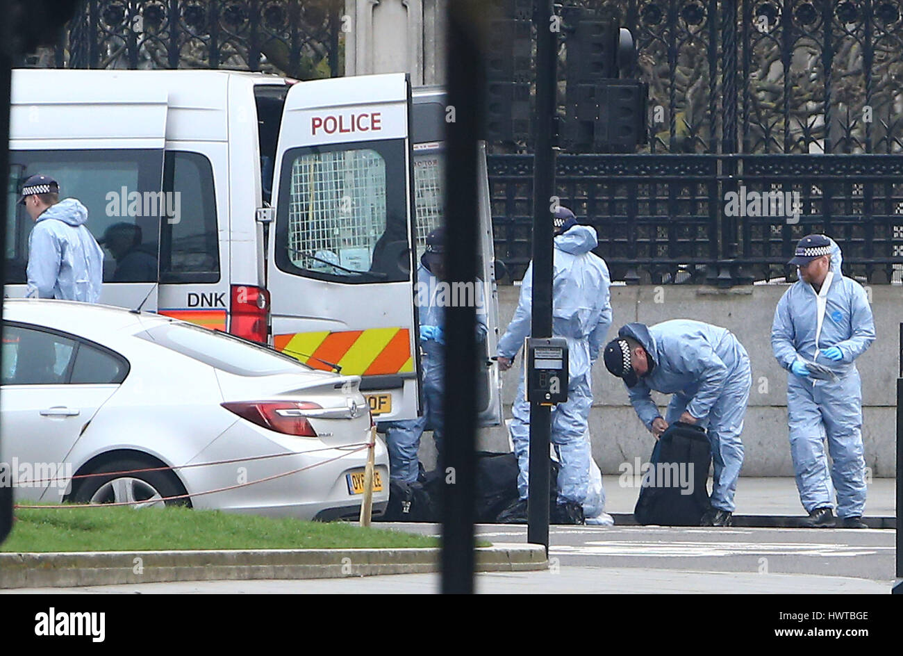 Police forensic officers outside the Houses of Parliament in London ...