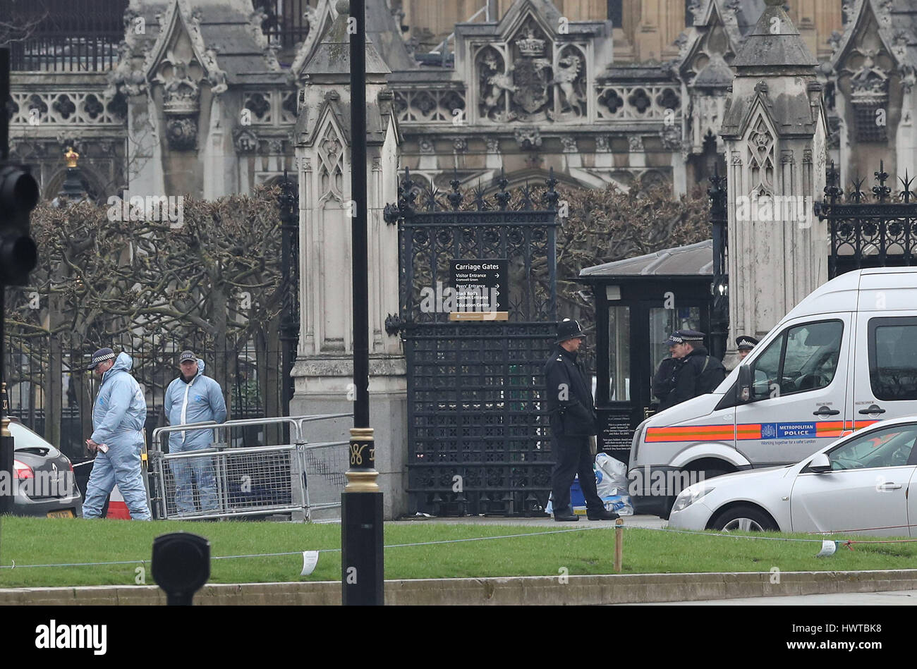 Police forensic officers outside the Houses of Parliament in London ...
