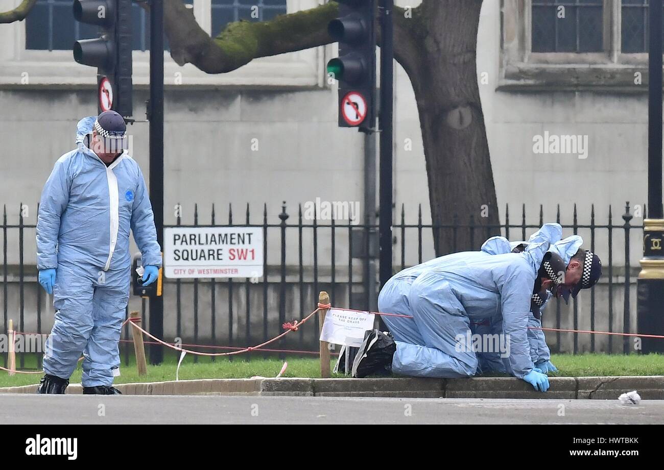 Police forensic officers in Parliament Square outside the Houses of ...