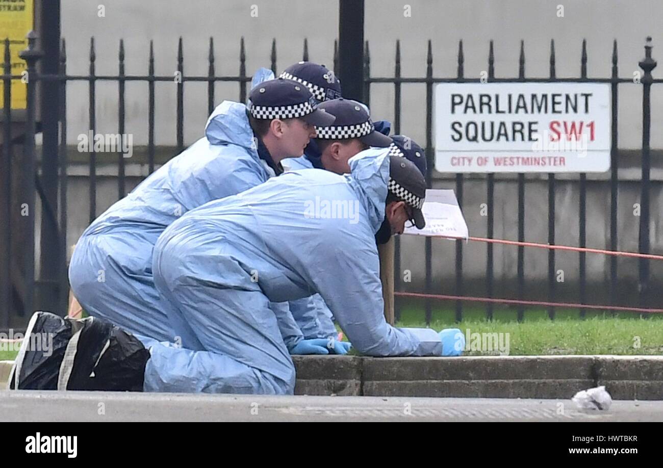 Police forensic officers in Parliament Square outside the Houses of ...