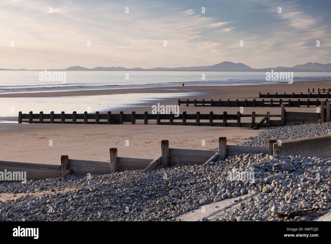 Groynes or breakwaters at Barmouth beach to protect the environment from coastal erosion Stock Photo