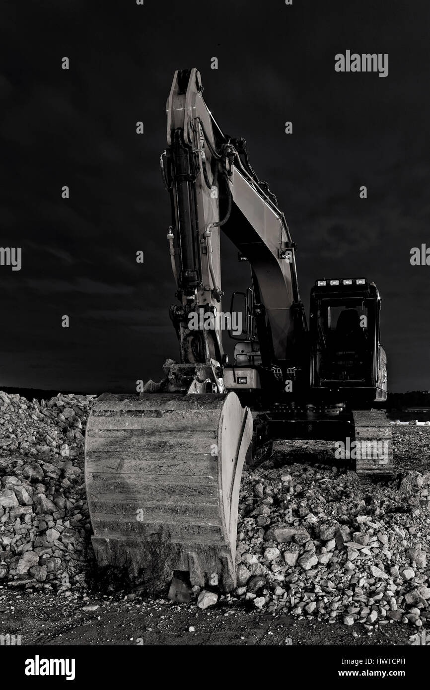 close up excavator at night, front view Stock Photo