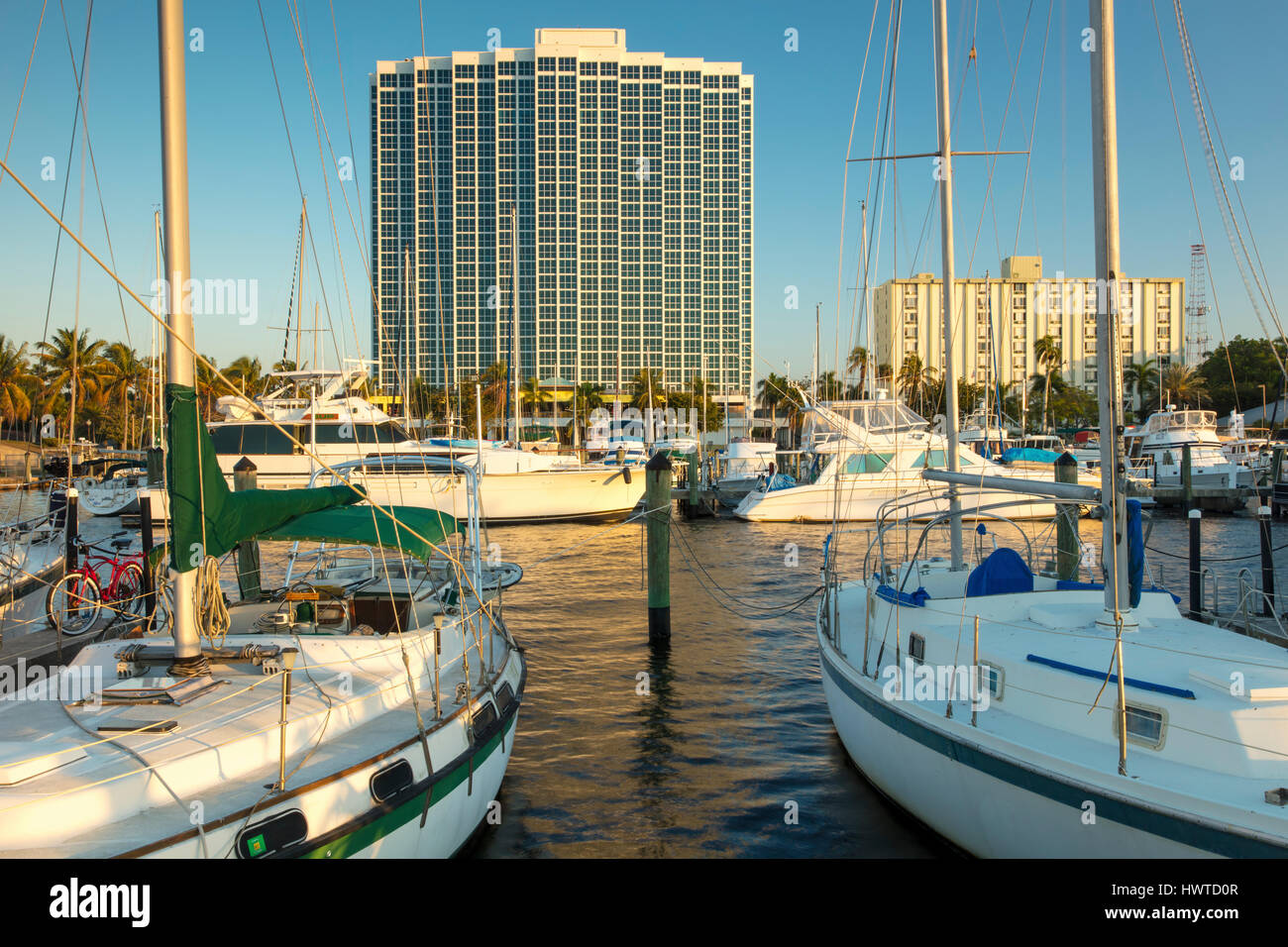 Boats moored in the Fort Myers Yacht Basin with condominium towers beyond, Ft Myers, Florida
