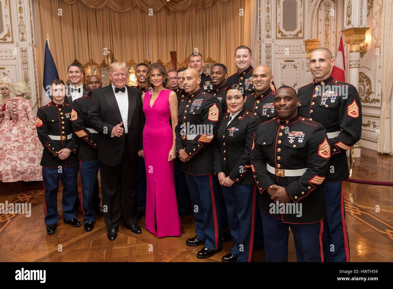 U.S President Donald Trump and First Lady Melania Trump pose for a photo with members of the United States Military prior to attending a private event at The Mar-a-Lago Club February 4, 2017 in Palm Beach, Florida. Stock Photo