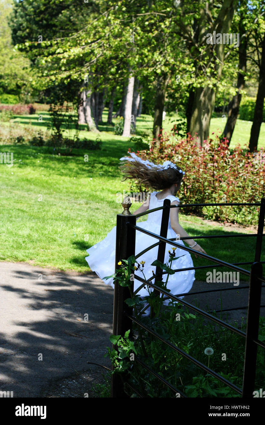 Communion girl in the garden Stock Photo Alamy