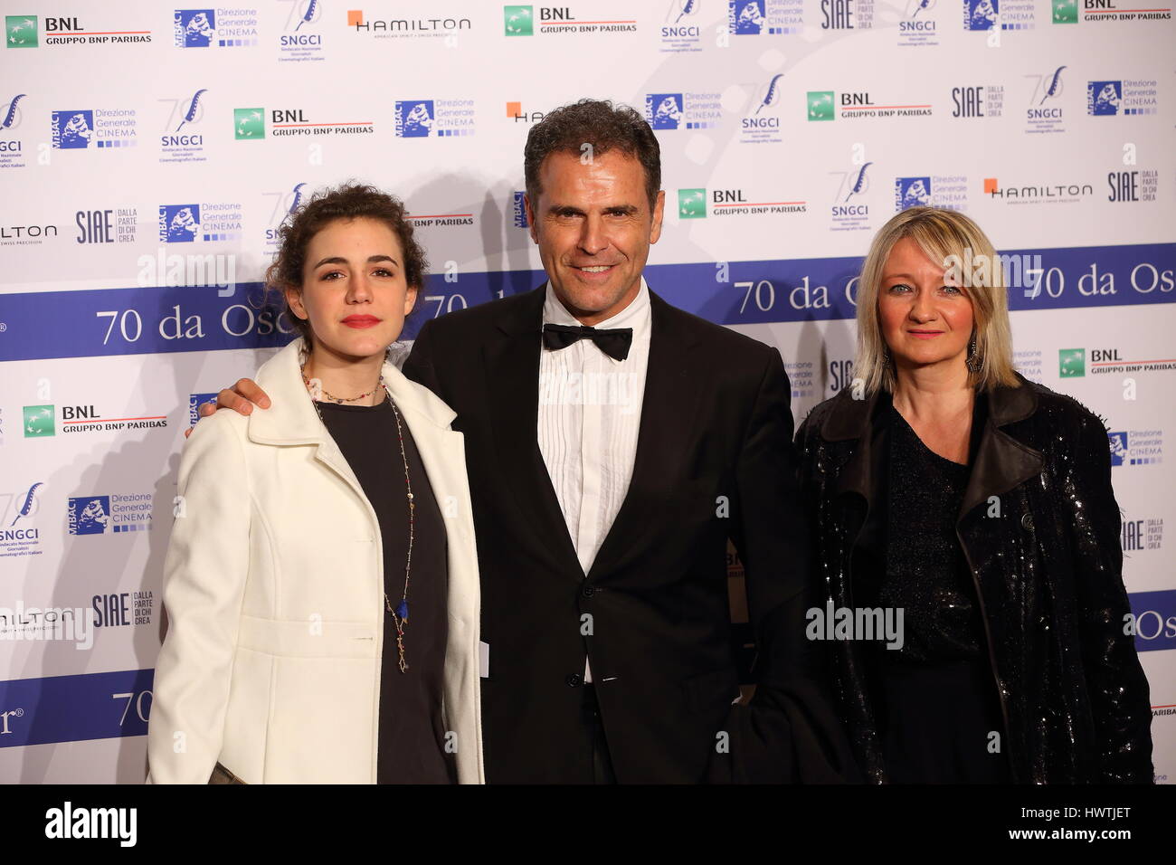 Rome, Italy. 22nd Mar, 2017. Italian actor Pino Quartullo with his wife and daughter during Photocall of the evening concludes special events for the first 70 years of the Syndicate of Film Journalists and the 'Nastri d'Argento' Credit: Matteo Nardone/Pacific Press/Alamy Live News Stock Photo