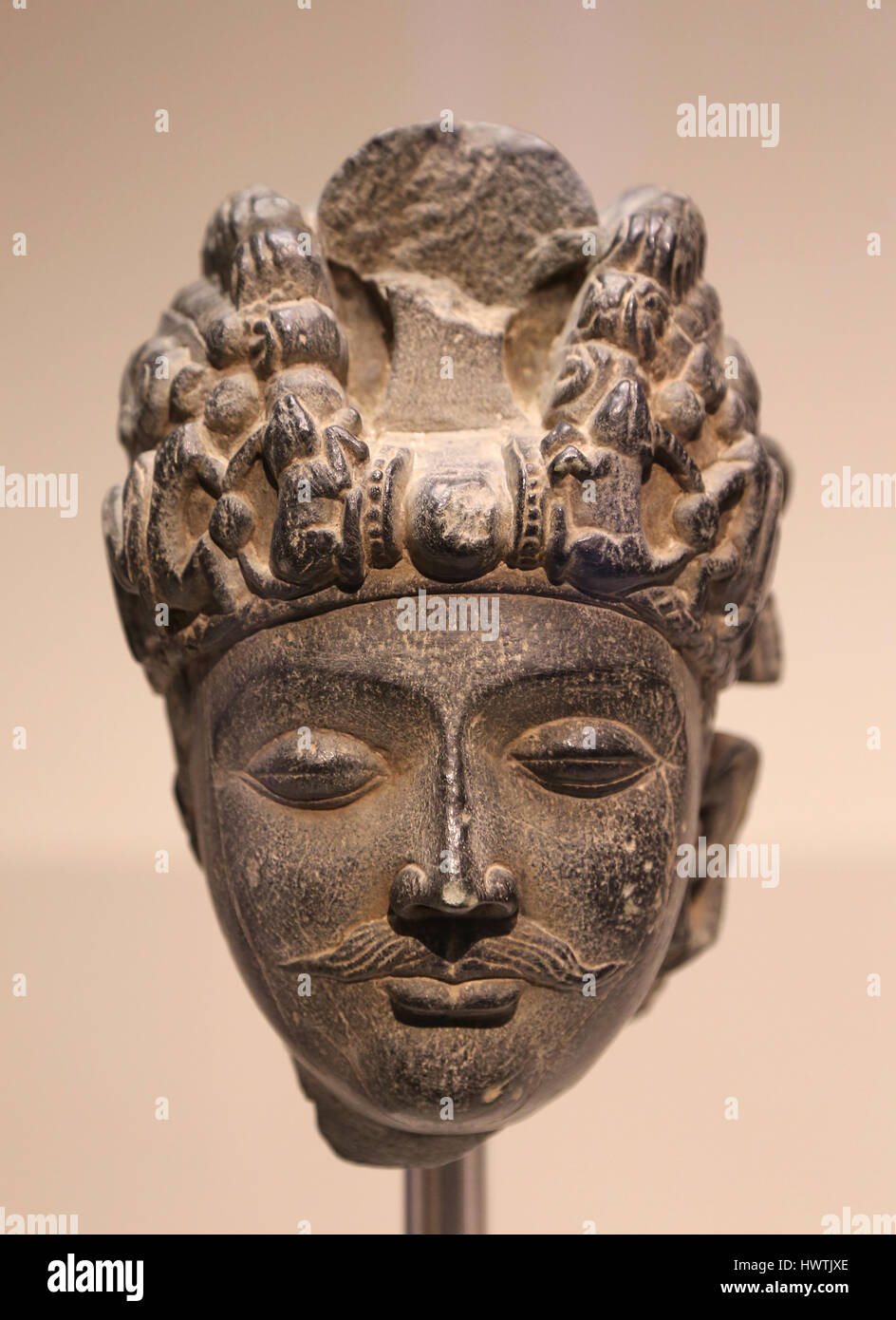 Head of Bodhisattva. Schist stone sculpture.  100-300 CE. Gandhara, Kandahar. Afghanistan Stock Photo