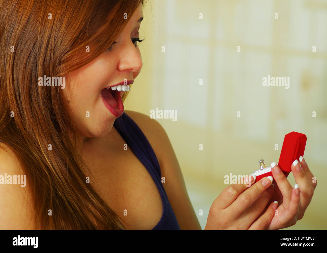Surprised girl holding jewelry hi-res stock photography and images - Alamy