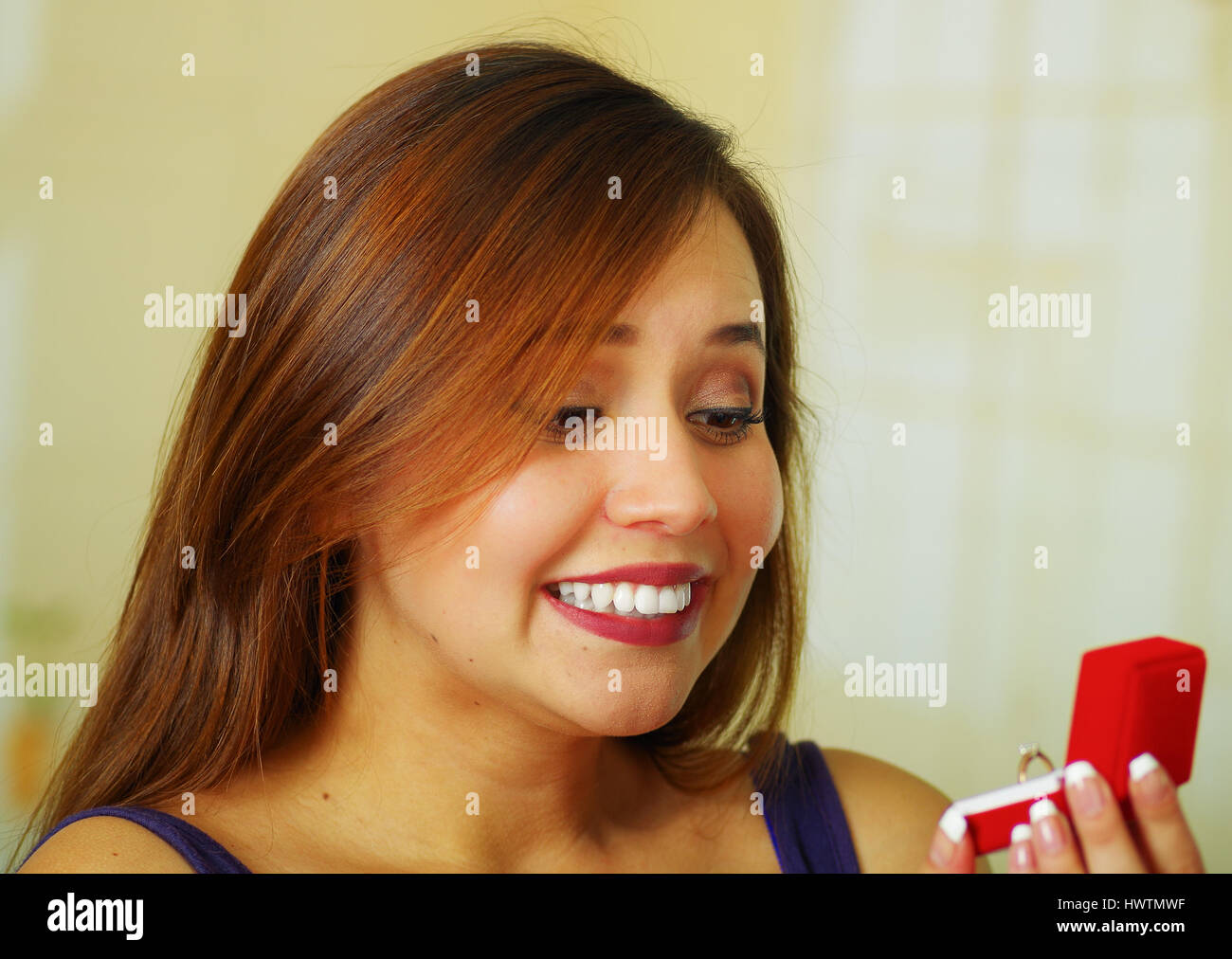 Surprised girl holding jewelry hi-res stock photography and images - Alamy