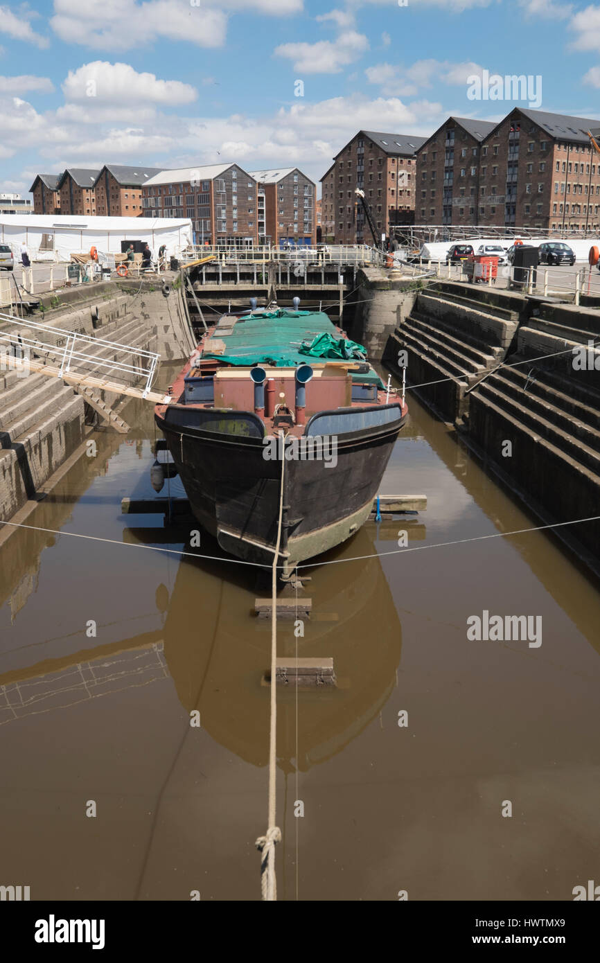 Unpowered barge Sabrina 5 in Gloucester drydock for repairs and restoration. Stock Photo