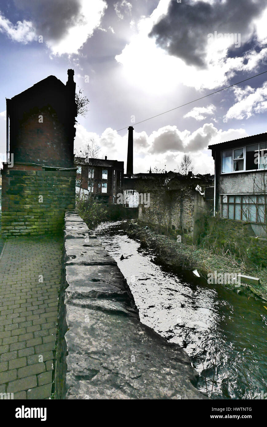 River Calder running through rundown industrial  area of Burnley,Lancashire,UK Stock Photo