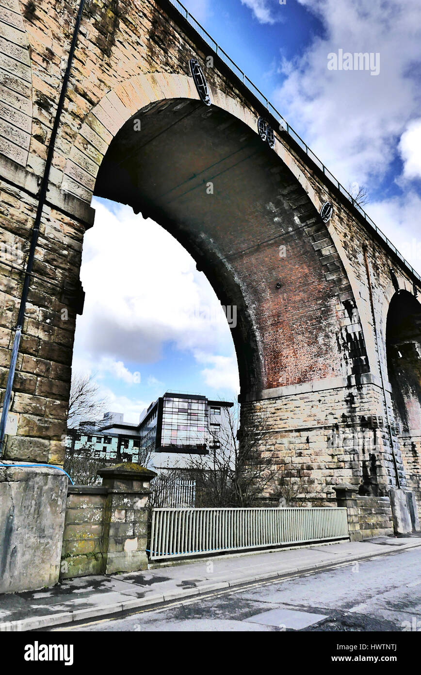 Old and new.University of Central Lancashire building seen through old viaduct,Burnley,Lancashire,UK Stock Photo