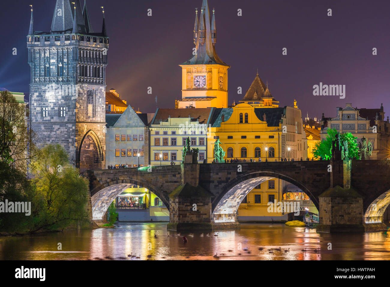 Stare Mesto Prague night, the historical center of east Prague, the Stare Mesto, illuminated at night, with the Charles Bridge in the foreground, CZ Stock Photo