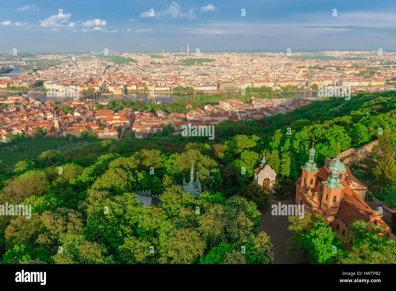Petrin Hill Prague, aerial view of Petrin Hill park in Prague with the city's historic old towns of Mala Strana and Stare Mesto divided by the river. Stock Photo
