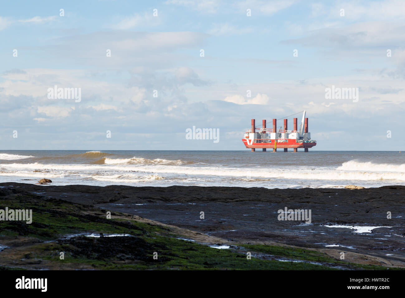 STAITHES, ENGLAND - MARCH 1: The 'MPI Resolution' world’s first purpose-built vessel for installing offshore wind turbines, foundations and transition Stock Photo