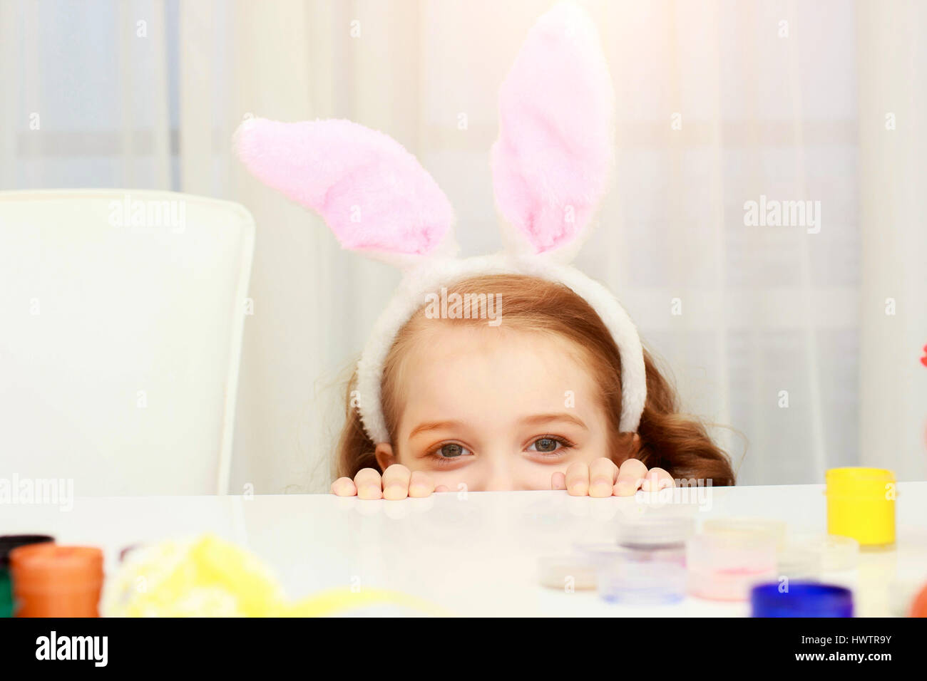 little girl wearing bunny ears on Easter day Stock Photo