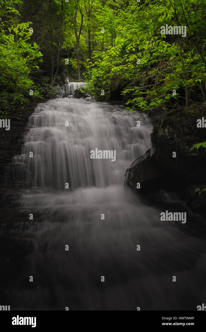 Found within the New River Gorge, a small cascade conceals the larger falls of Craigs Branch as if lying in wait to be discovered. Stock Photo