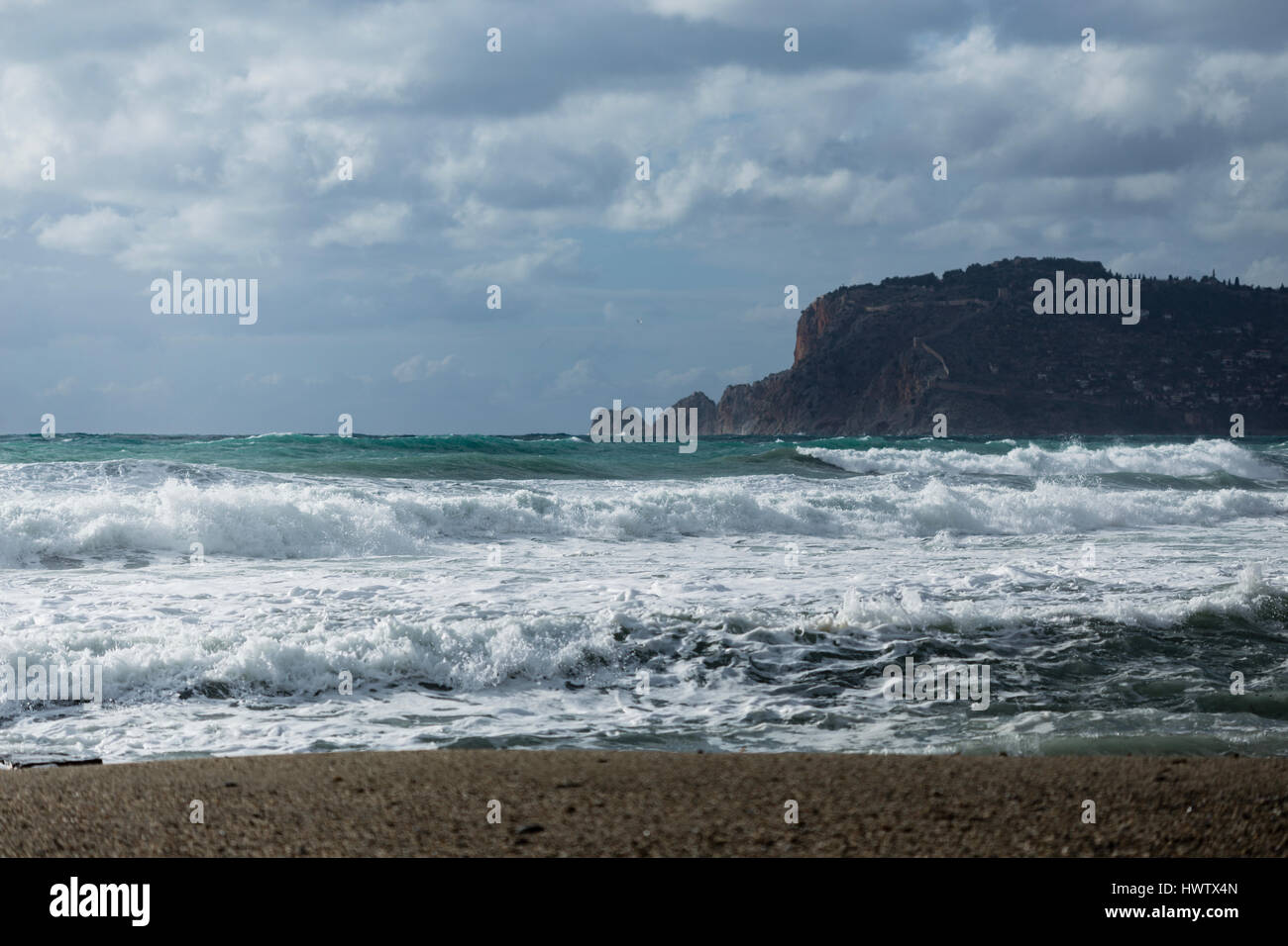 Seascape showing powerful waves heating coast of Alanya shot on cloudy day landscape layout Stock Photo